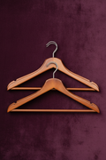 Brown Wooden Hangers on Velvet